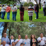 Comunidad marista en retiro espiritual en Guatemala, en oración frente a la estatua de San Marcelino Champagnat.